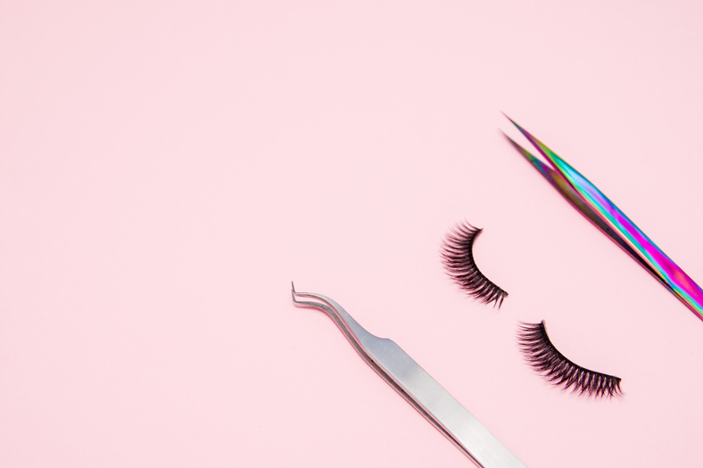 Eyelash Extensions and Tools on Pink Background